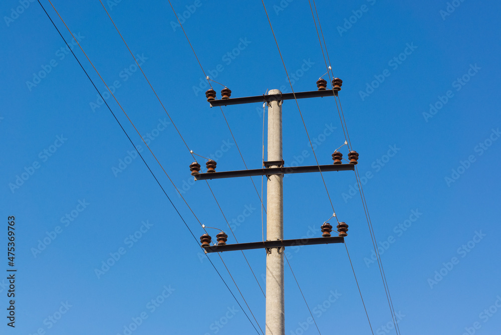 electric pole on a background of blue sky visible power line electric pole on a background of blue sky visible power line