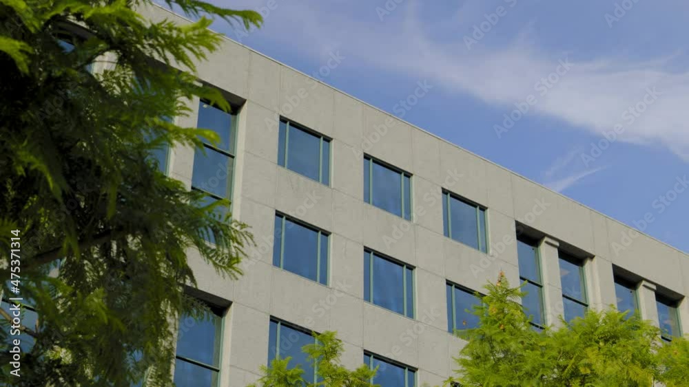 MODEST, MODERN OFFICE BUILDING ESTABLISHING SHOT. 4K LOCK OFF. NO PEOPLE. MODEST, MODERN OFFICE BUILDING ESTABLISHING SHOT. 4K LOCK OFF. NO PEOPLE.