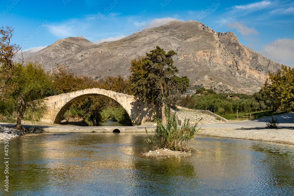 Beautiful arched bridge of Preveli crossing the Megas River on its way to the palm beach in the Libyan sea, Southern Crete, Greece