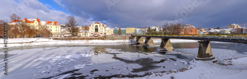 The central square of the historic center of Uzhgorod and the bridge over the Uzh River, Ukraine, in winter during the New Year and Christmas holidays