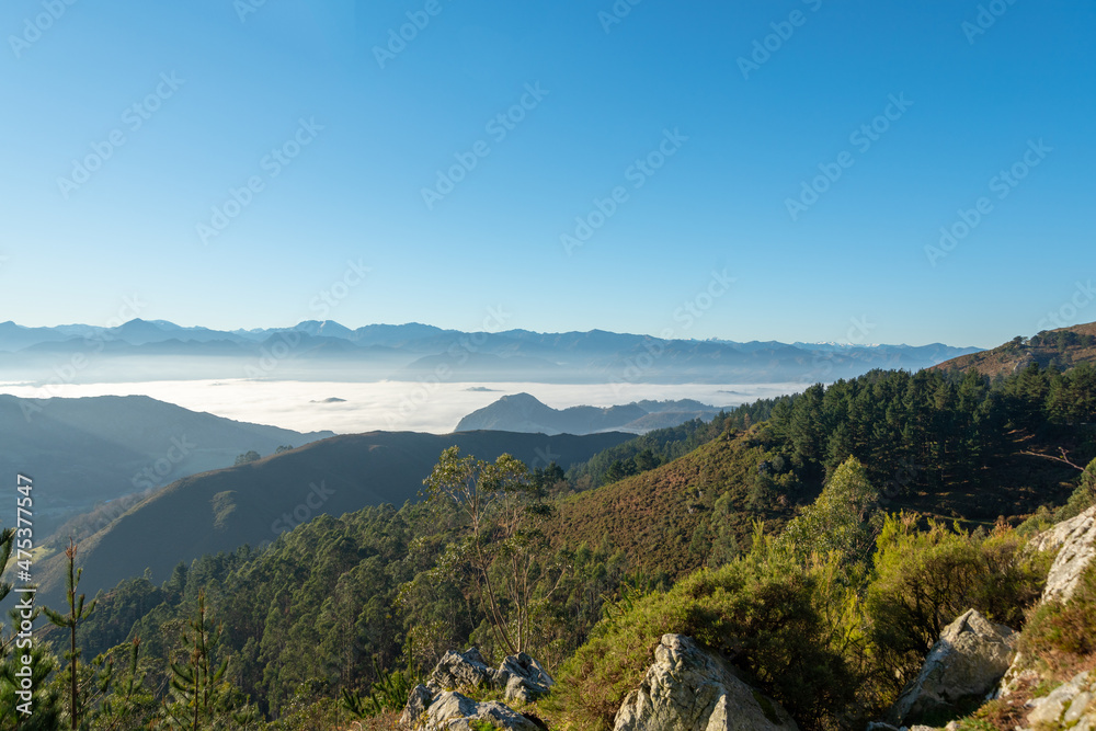 views of the Picos de Europa mountains with fog in the distance views of the Picos de Europa mountains with fog in the distance