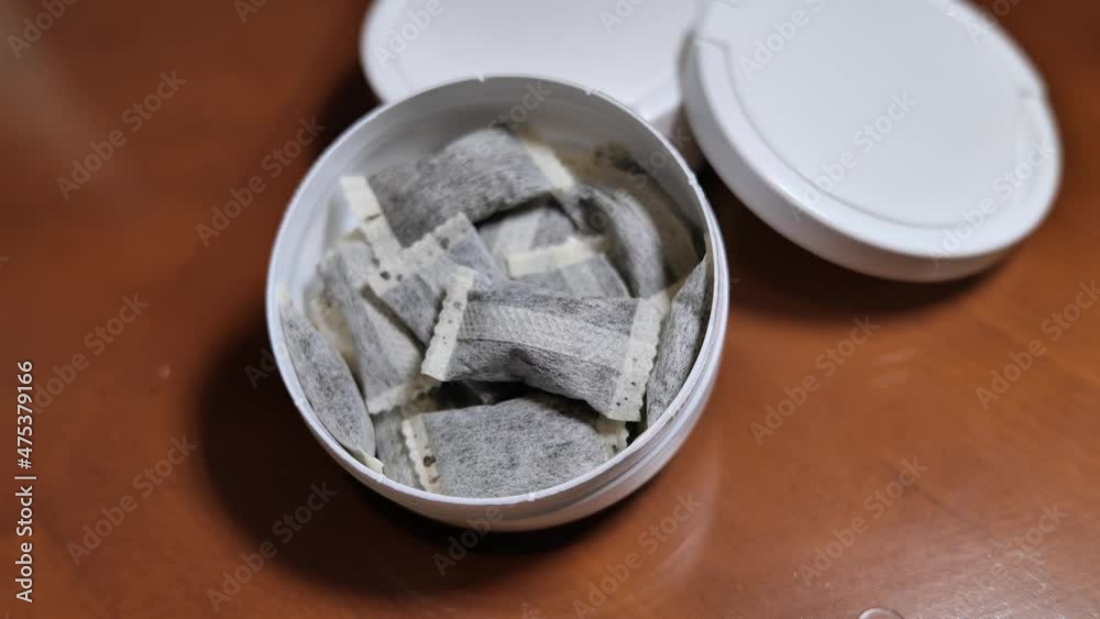 Snus,  moist powder tobacco product widely consumed in Norway and Sweden and among athletes, close-up with no label box