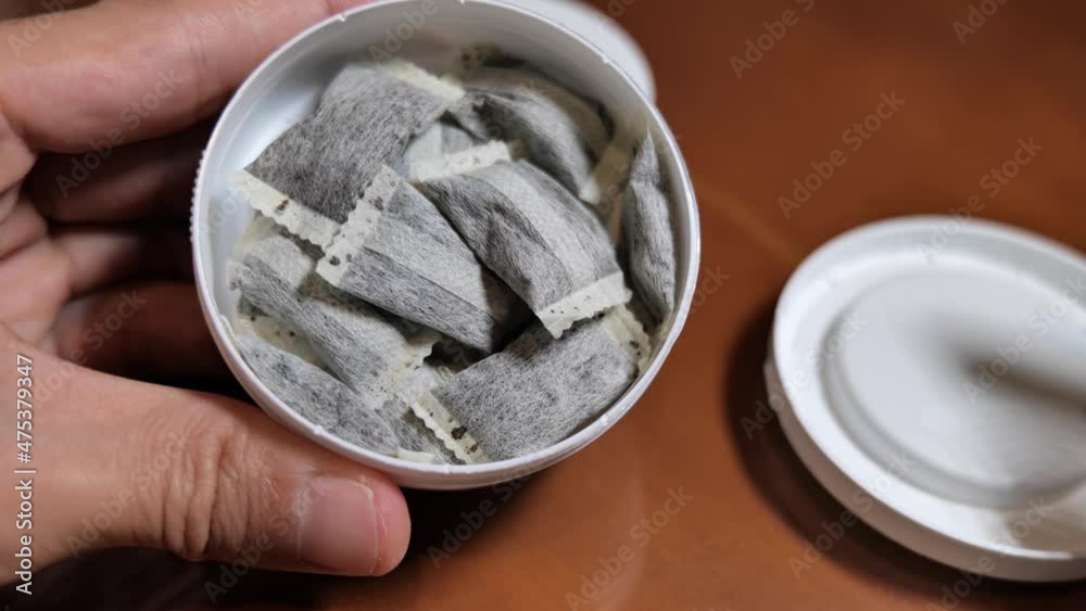 Snus,  moist powder tobacco product widely consumed in Norway and Sweden and among athletes, close-up with no label box