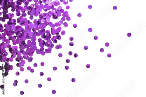 Purple round confetti on white background. Festive day backdrop. Flat lay style with minimalistic design. Template for banner or party invitation