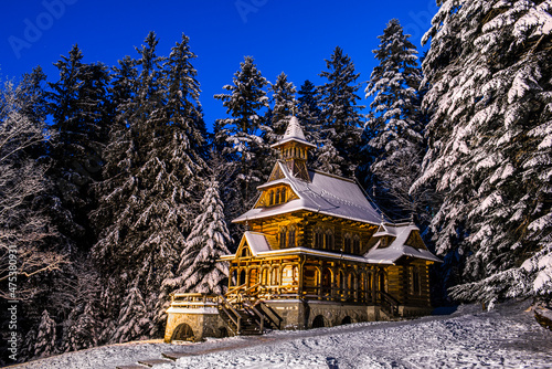 Jaszczurowka in Zakopane, Wooden Chapel in Snowy Winter Forest, Poland. photo