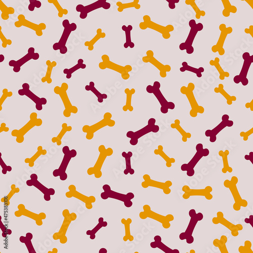 Seamless pattern with yellow and purple bones.
