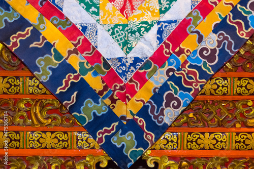 Buddhist flag with architectural details in Drepung Monastery, one of the great three Gelug university monasteries of Tibet, Lhasa, Tibet, China photo