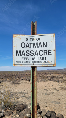 Vertical shot of the Oatman Massacre site signpost in Yuma, Arizona photo