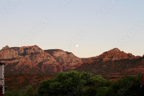 valley at sunset with moon
