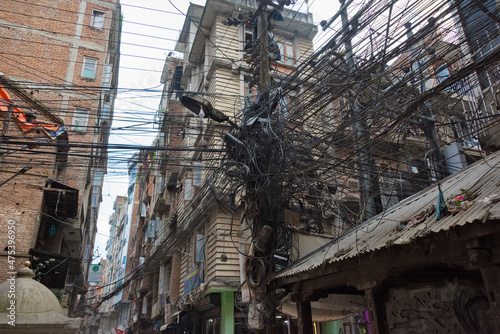 Tangled wire with house on the street, Kathmandu, Nepal © Danita Delimont