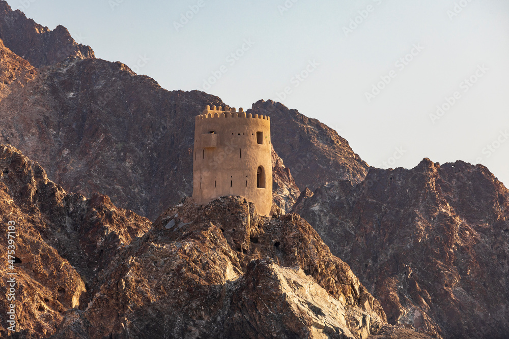 Middle East, Arabian Peninsula, Oman, Muscat, Muttrah. Fortified tower on a mountain above Muttrah.