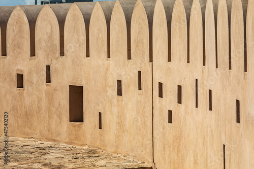Middle East, Arabian Peninsula, Al Batinah South. Crenulated wall in Sur, Oman. photo