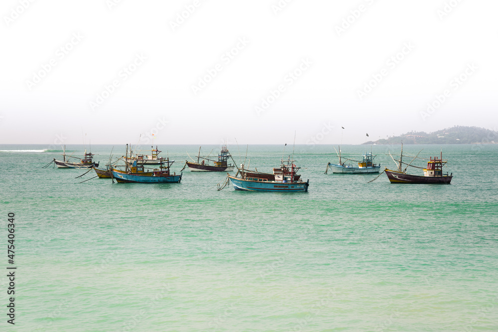 Old fishing boat on a background of blue sky Old fishing boat on a background of blue sky
