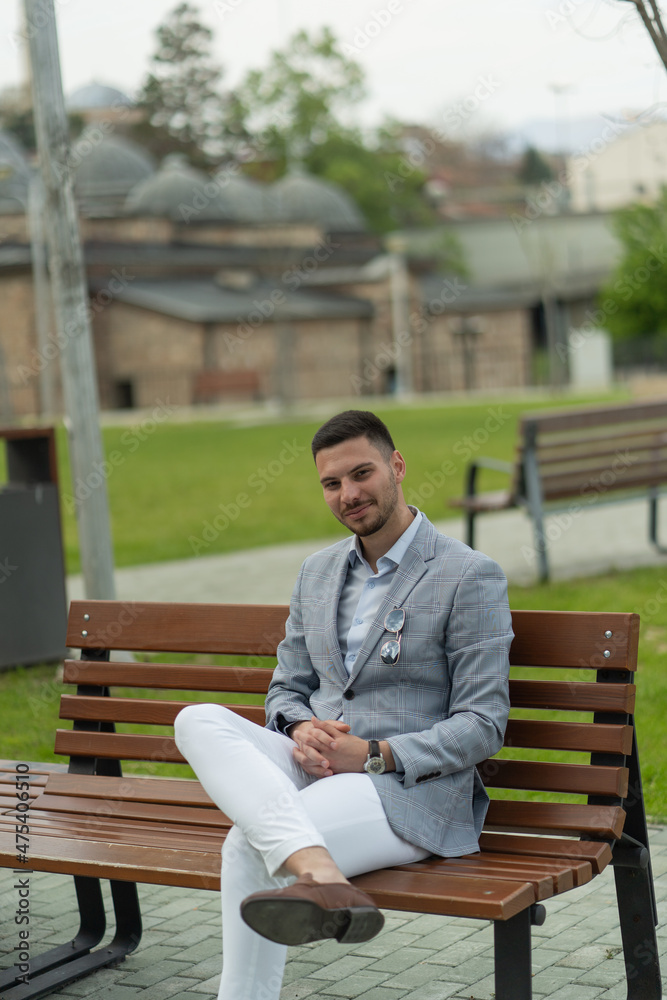 Fototapeta premium Businessman is sitting on the bench
