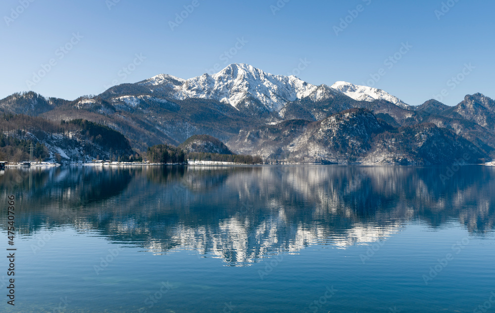 Lake Kochelsee at village Kochel am See during winter in the Bavarian Alps. Mt. Herzogstand in the background. Germany, Bavaria