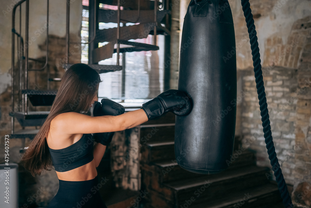 Young woman boxing workout at the gym