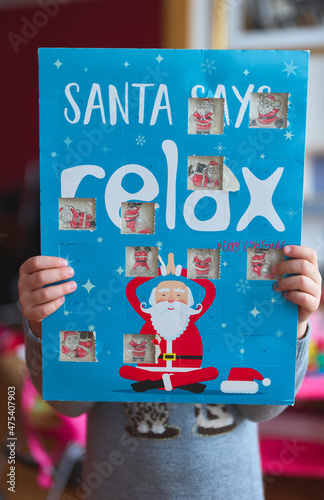 girl showing an advent calendar at Christmas time