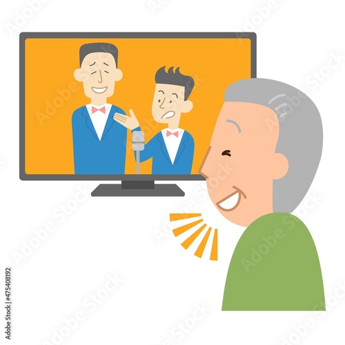 テレビでお笑い番組を見るシニア男性②
