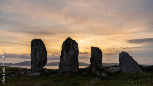 Europe, Ireland, Waterville. Eightercua stone row at sunset.
