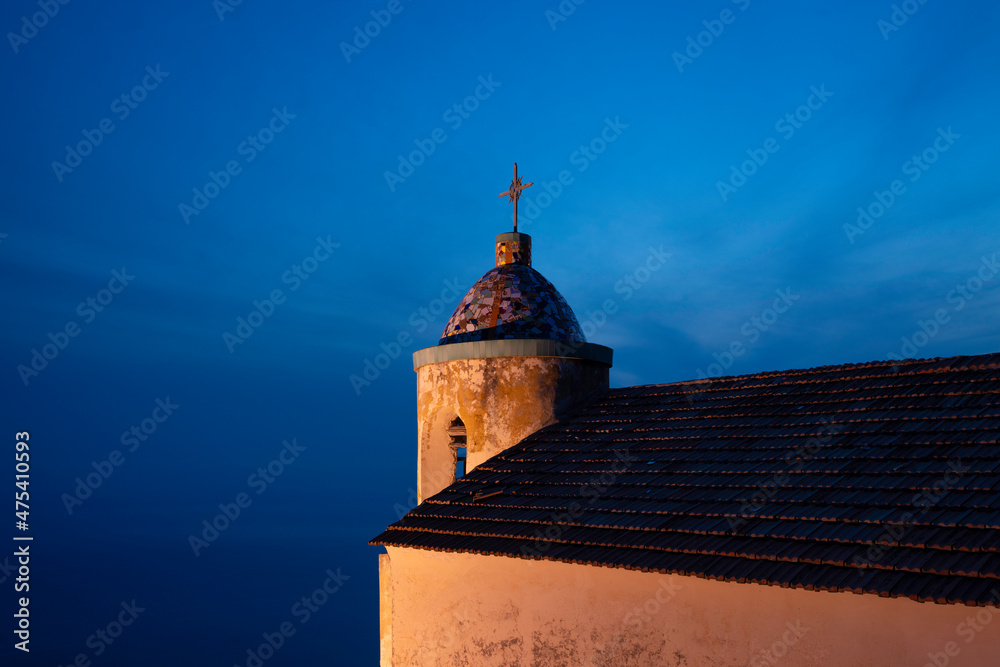 Europe, Italy, Furore. Church roof and steeple at sunset.