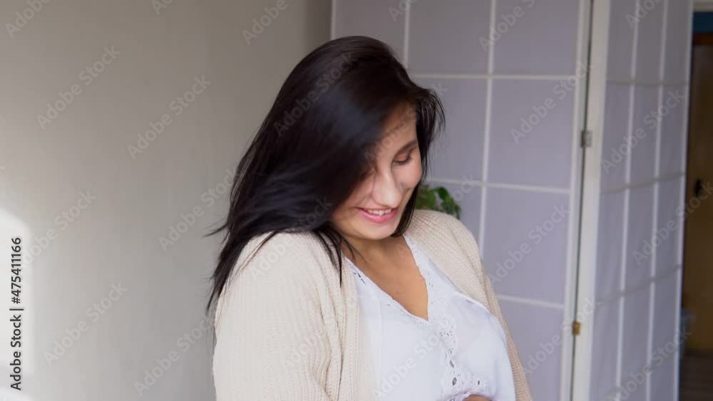 beautiful pregnant woman strokes her stomach waiting for a baby beautiful pregnant woman strokes her stomach waiting for a baby