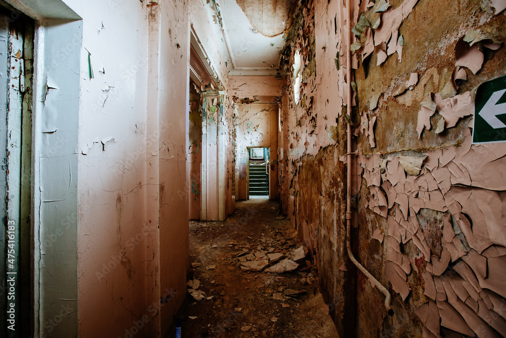 Fototapeta premium Dark and creepy corridor of old abandoned mental hospital