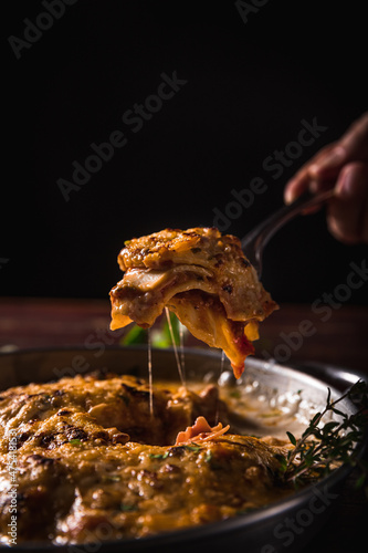 Delicious Pizza Classic Homemade Tomato Sauce Sausage Cheese Onion Chicken Meat Pasta Shrimp Restaurant Menu Gourmet on a wooden table Dark Background