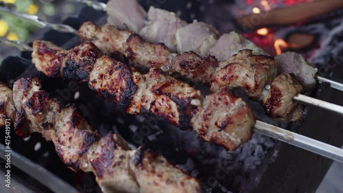 Delicious Shish Kebab Meat being prepared on burning coals.