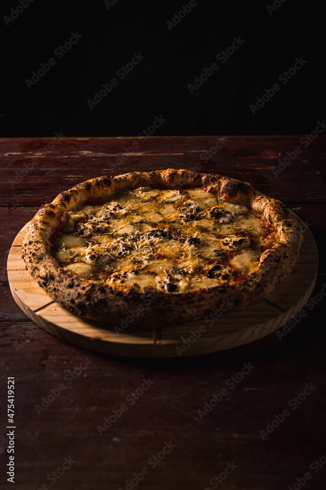 Delicious Pizza Classic Homemade Tomato Sauce Sausage Cheese Onion Chicken Meat Pasta Shrimp Restaurant Menu Gourmet on a wooden table Dark Background Delicious Pizza Classic Homemade Tomato Sauce Sausage Cheese Onion Chicken Meat Pasta Shrimp Restaurant Menu Gourmet on a wooden table Dark Background