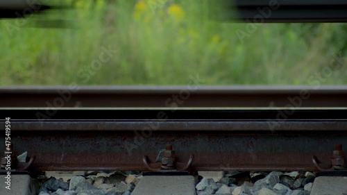 Closeup of Train Wheels on Railroad as it is passing by.
