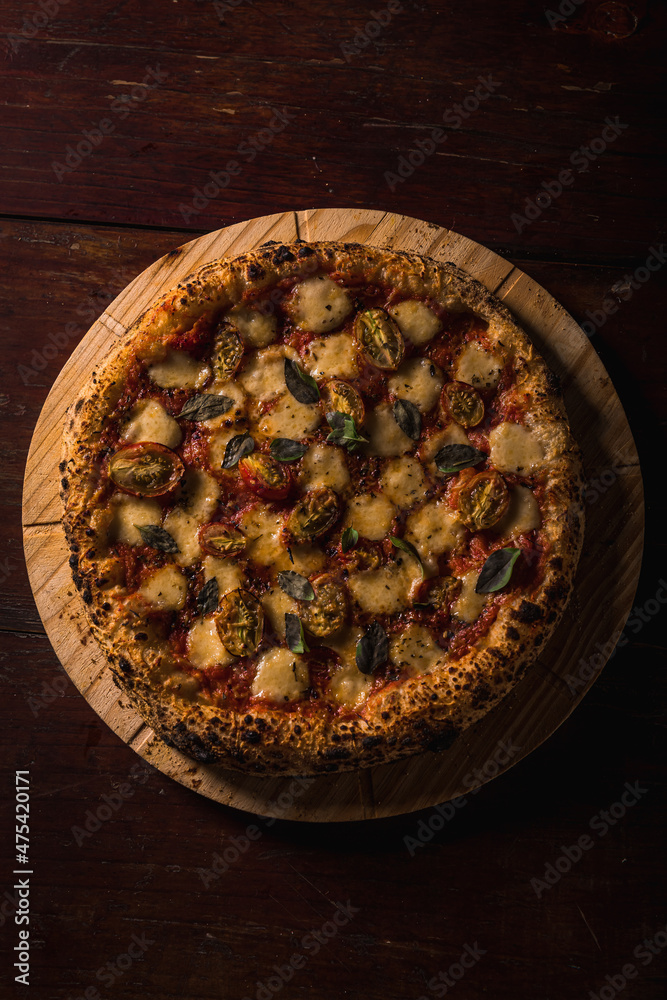 Delicious Pizza Classic Homemade Tomato Sauce Sausage Cheese Onion Chicken Meat Pasta Shrimp Restaurant Menu Gourmet on a wooden table with dark background Delicious Pizza Classic Homemade Tomato Sauce Sausage Cheese Onion Chicken Meat Pasta Shrimp Restaurant Menu Gourmet on a wooden table with dark background
