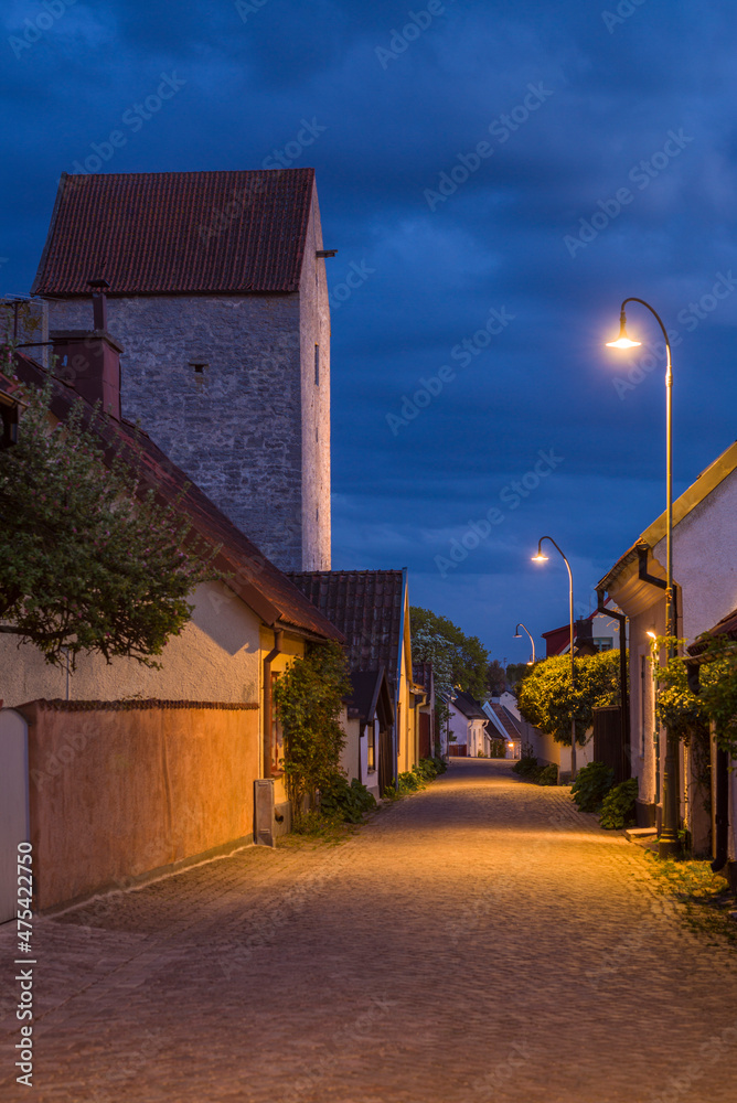 Sweden, Gotland Island, Visby, 12th century city wall, most complete medieval city wall in Europe, Osterport Tower, dusk