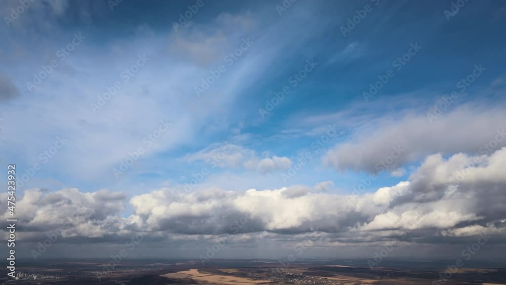 Aerial view from high altitude of earth covered with puffy rainy clouds forming before rainstorm Aerial view from high altitude of earth covered with puffy rainy clouds forming before rainstorm