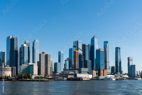 New York City skyline from New Jersey over the Hudson River with the skyscrapers of the Hudson Yards district at day time. Manhattan, Midtown, NYC, USA. A vibrant business neighborhood © VideoFlow