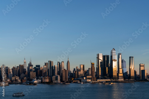 Aerial New York City skyline from New Jersey over the Hudson River with the skyscrapers of the Hudson Yards district at sunset. Manhattan  Midtown  NYC  USA. A vibrant business neighborhood