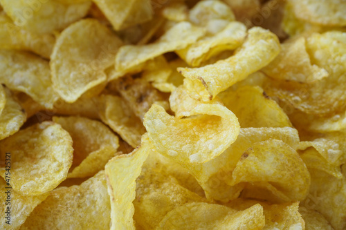 Fried potato chips in detail.