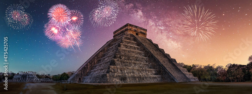 chitchenitza with milky way sky and fireworks photo