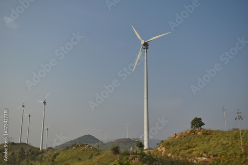 Canvas Print Selective focus photo of Multiple Windmills which are source of renewable energy