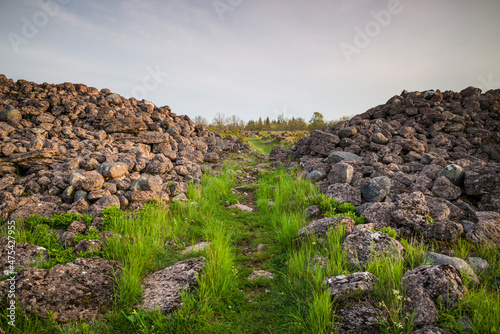 Sweden, Oland Island, Ismantorp, ruins of Ismantorp fortress, Bronze Age fortified town, sunset