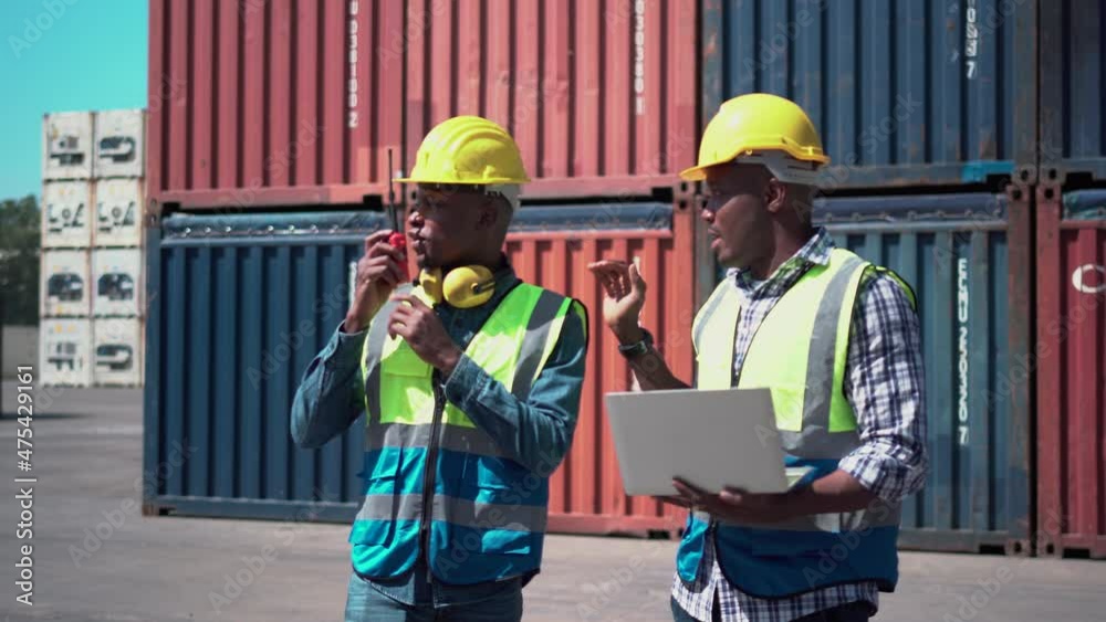 Worker team checking containers box from cargo, Dock workers discuss shipping logistics in a shipyard
Worker team checking containers box from cargo, Dock workers discuss shipping logistics in a shipyard