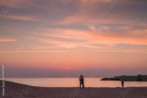 Sweden, Scania, Malmo, Riberborgs Stranden beach area, couple kissing at sunset © Danita Delimont