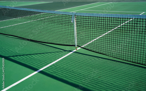 Close up of tennis court and net.