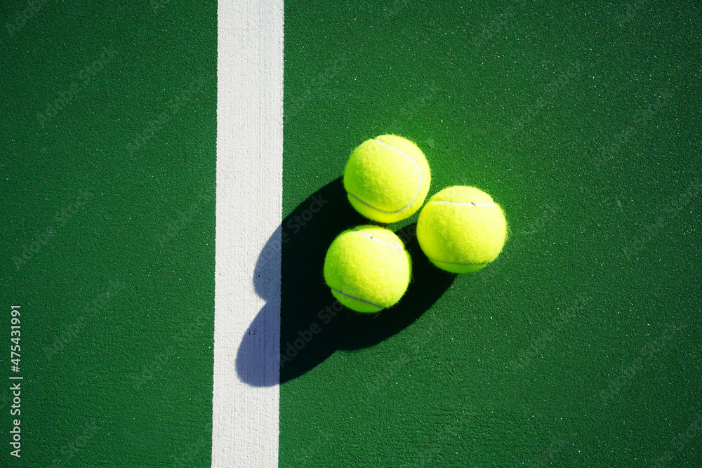 Tennis balls on tennis court.               