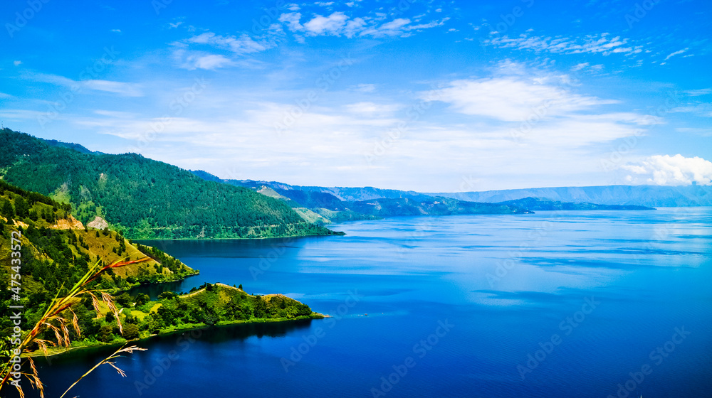 The beauty of Lake Toba which is a caldera lake comes from an ancient volcanic eruption and is the largest volcanic lake in the world. North Sumatra, Indonesia