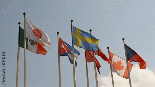 Various national flags countries under a blue sky. photo