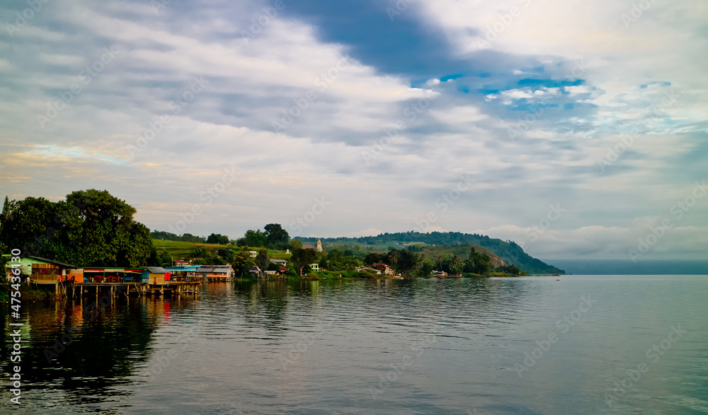 Fototapeta premium The beauty of Lake Toba which is a caldera lake comes from an ancient volcanic eruption and is the largest volcanic lake in the world. North Sumatra, Indonesia