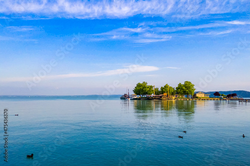 Blue sea with a manmade island in the morning photo