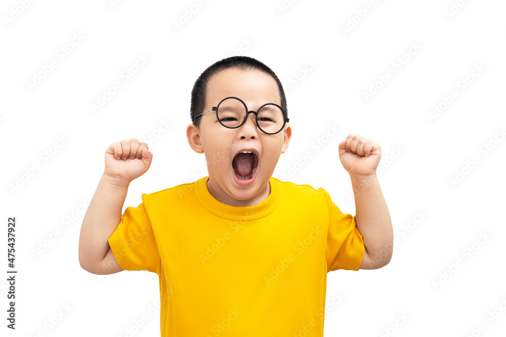 Little boy wearing casual yellow T shirt standing over isolated white background very happy and excited doing winner gesture with arms raised, smiling and screaming for success. Celebration concept. Little boy wearing casual yellow T shirt standing over isolated white background very happy and excited doing winner gesture with arms raised, smiling and screaming for success. Celebration concept.