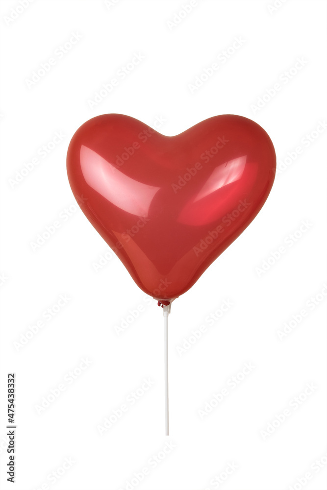 Red balloon in the shape of a heart on a white stick isolated on a white background.