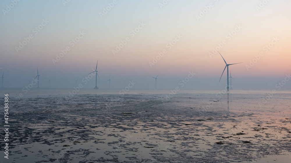 A wind farm on the coastline in the morning, Jiangsu, China